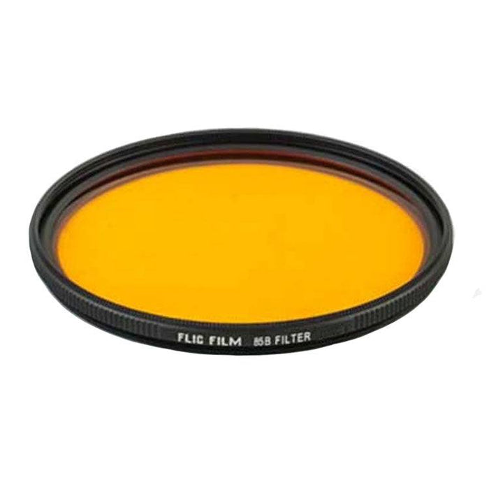 Yellow camera lens filter with black frame on a white background